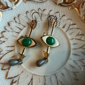 Gold-Tone Eye Arrow Earrings with Green Accent and Gray Drop